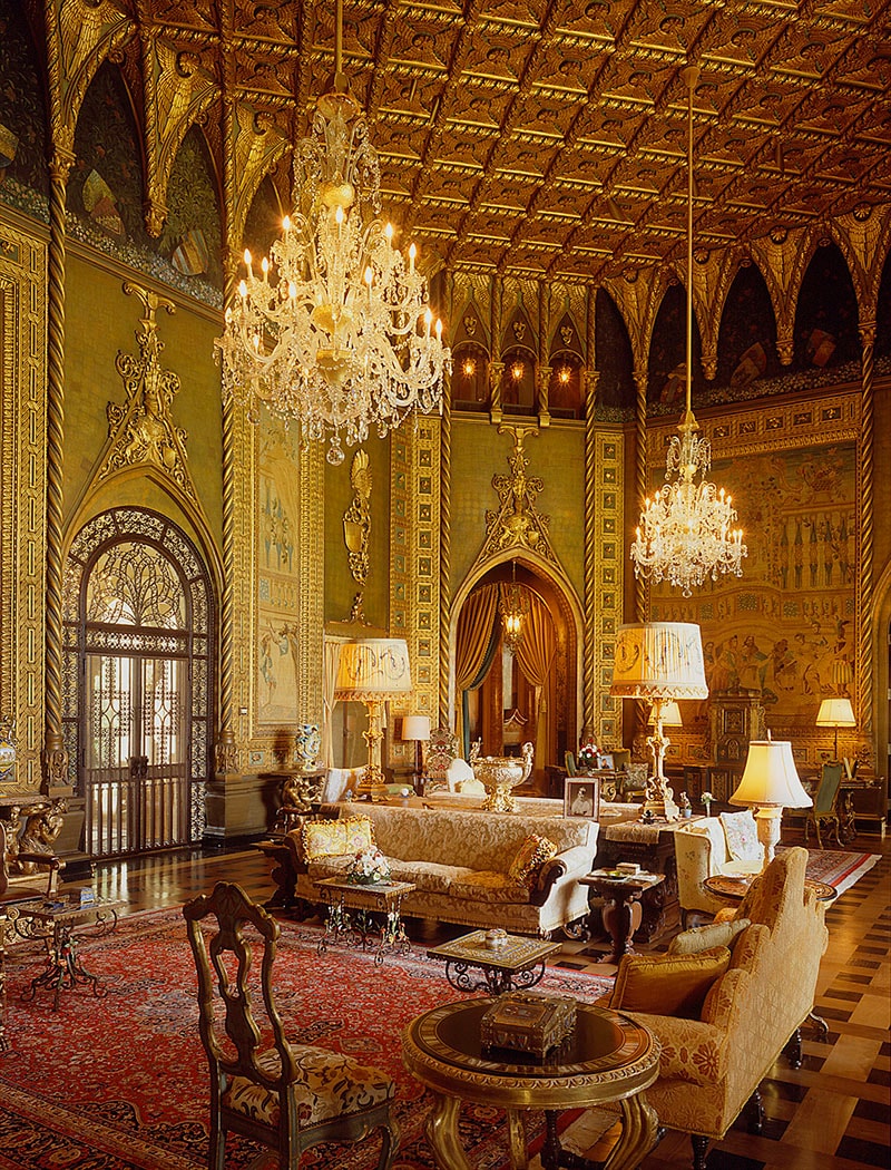 Palatial gold ballroom with crystal chandeliers, Gothic arches and ornate ceiling