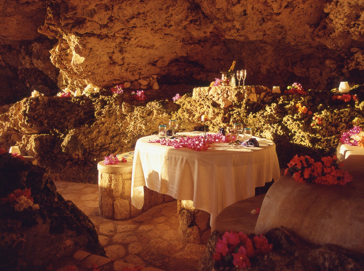 Intimate cave dining room with floral table setting